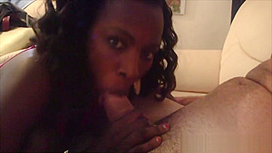African cutie enjoys slurping long white cock