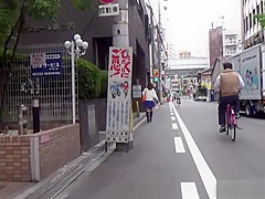 Asian whore pees behind car