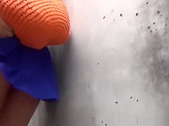 Asian whore pees behind car