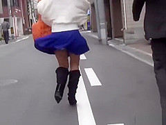 Asian whore pees behind car