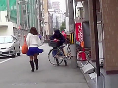 Asian whore pees behind car