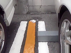 Asian whore pees behind car