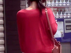 Asian whore pees behind car