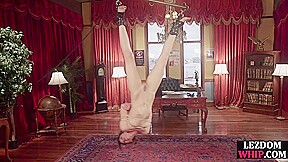 BDSM lezdom fists sub pussy while toys her ass with strapon