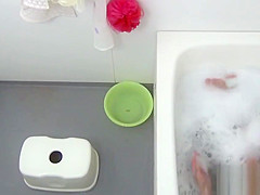 Bathing asian masturbates
