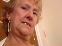 Blonde Granny in stockings posing and teasing