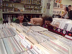 Brunette butt fingered in public shop