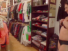 Brunette butt fingered in public shop