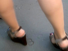 Candid young blond, sexy legs in wedges heels