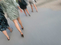 Candid young blond, sexy legs in wedges heels