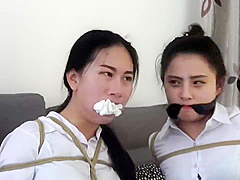 Chinese secretaries in white shirts are thoroughly gagged