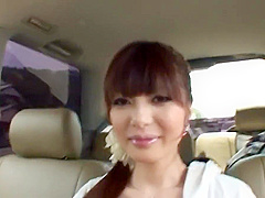 Fresh faced brunette masturbates in the back seat of a car