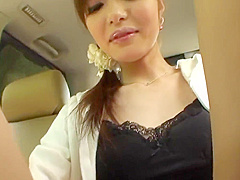 Fresh faced brunette masturbates in the back seat of a car