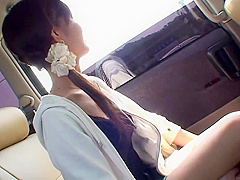 Fresh faced brunette masturbates in the back seat of a car