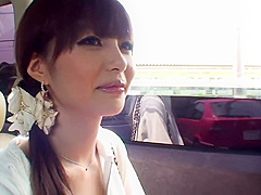 Fresh faced brunette masturbates in the back seat of a car