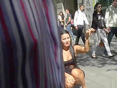 Handcuffed redhead kneeling in public