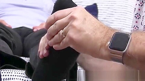 Hunky dude receives a skillful foot massage from his friend