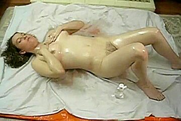 In Babyoil Masturbating Hairy Pussy
