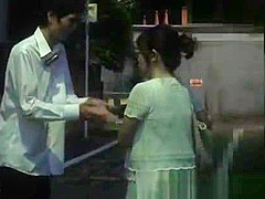 Mature Japanese AV model gives a hand job in the car