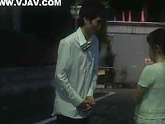 Mature Japanese AV model gives a hand job in the car