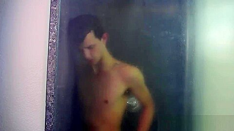 Nasty cock sucker Jasper Robinson wanks in the shower solo