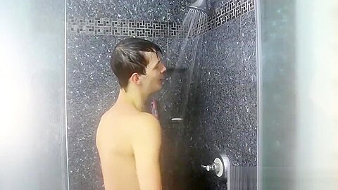 Nasty cock sucker Jasper Robinson wanks in the shower solo