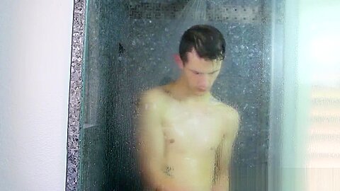 Nasty cock sucker Jasper Robinson wanks in the shower solo