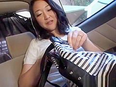 Naughty Japanese milf fucks stranger in a car
