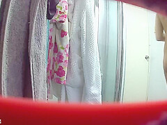 Nepalese girl showering
