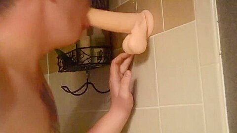 Shaved twink practices deepthroating in the shower