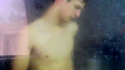 Tugging on his wet cock and moaning in the shower all alone