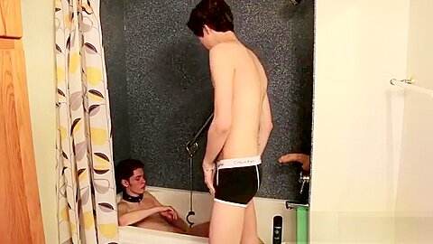Young emo twink busted in the shower lays down and jacks off
