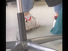 candid feet in white ankle socks and sneakers
