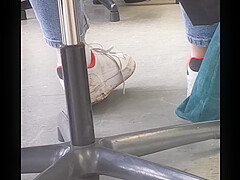 candid feet in white ankle socks and sneakers