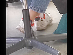 candid feet in white ankle socks and sneakers